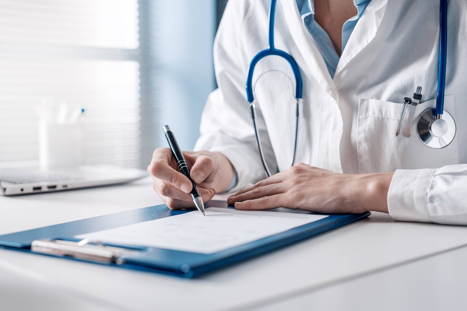 Doctor writing notes.